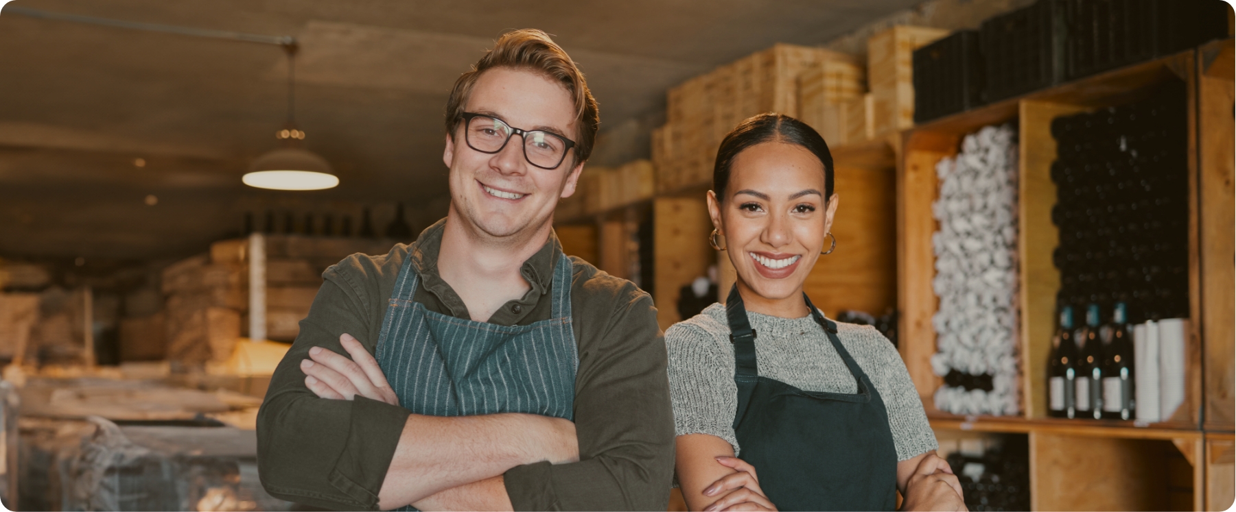 Two small-business owners in their warehouse, ready to play video